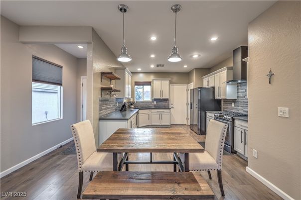 Dining room, Interior, Kitchen, Pendant Lights, Recessed Lighting, Stainless Steel Appliances, Wood Texture Flooring