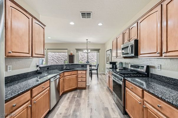 Dining room, Interior, Kitchen, Pendant Lights, Recessed Lighting, Stainless Steel Appliances, Wood Texture Flooring