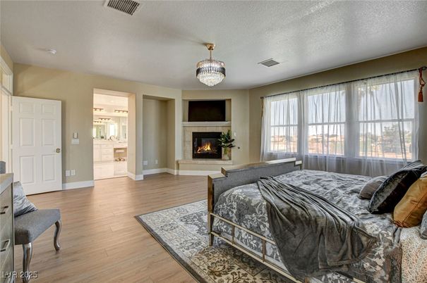 Bedroom, Chandelier, Fireplace, Interior, Wood Texture Flooring