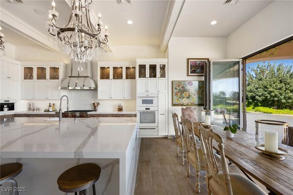 Chandelier, Dining room, Interior, Kitchen, Recessed Lighting, Stainless Steel Appliances, Wood Texture Flooring