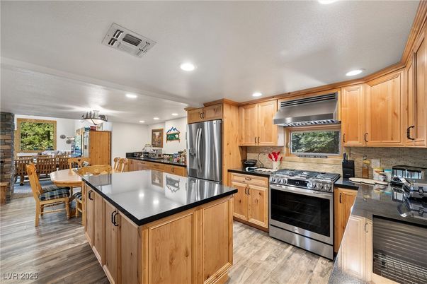 Chandelier, Dining room, Interior, Kitchen, Recessed Lighting, Stainless Steel Appliances, Wood Texture Flooring