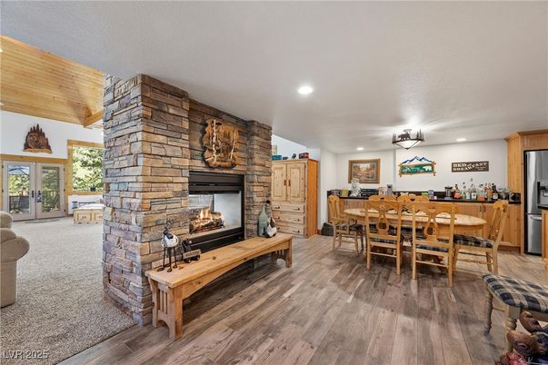 Dining room, Fireplace, Interior, Kitchen, Recessed Lighting, Stone Walls, Wood Texture Flooring