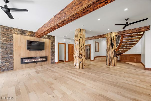 Empty room, Fireplace, Interior, Recessed Lighting, Stone Walls, Wood Texture Flooring