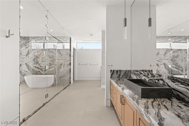 Bathroom, Dual Sink Vanities, Free Standing Baths, Glass Shower, Interior, Marble, Marble Walls, Pendant Lights, Recessed Lighting