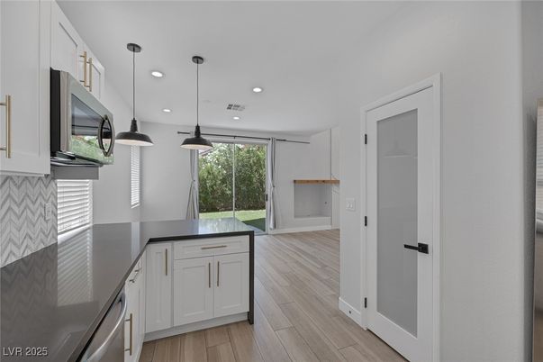 Interior, Kitchen, Pendant Lights, Recessed Lighting, Stainless Steel Appliances, Wood Texture Flooring