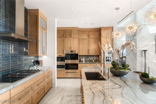Interior, Kitchen, Marble Walls, Pendant Lights, Recessed Lighting, Stainless Steel Appliances