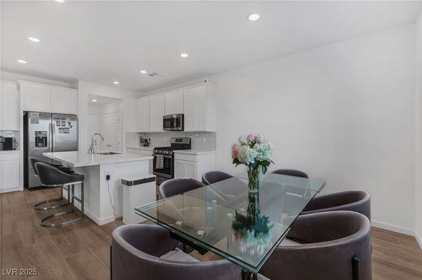 Dining room, Interior, Kitchen, Recessed Lighting, Stainless Steel Appliances, Wood Texture Flooring
