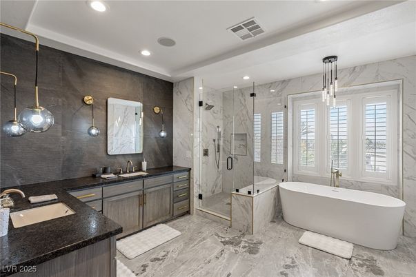Bathroom, Dual Sink Vanities, Free Standing Baths, Glass Shower, Interior, Marble, Marble Walls, Pendant Lights, Recessed Lighting