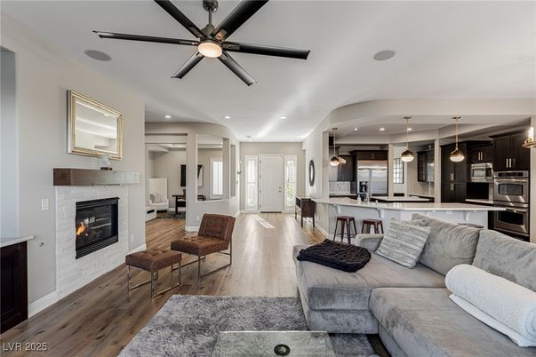 Fireplace, Interior, Kitchen, Living room, Pendant Lights, Recessed Lighting, Stainless Steel Appliances, Wood Texture Flooring