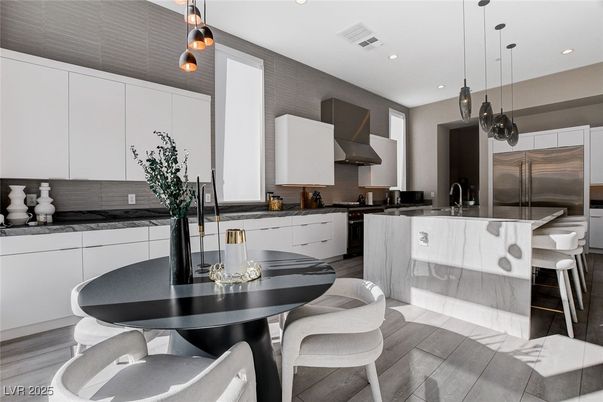 Dining room, Interior, Kitchen, Pendant Lights, Recessed Lighting, Stainless Steel Appliances, Wood Texture Flooring