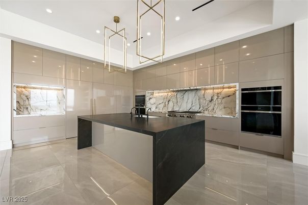 Interior, Kitchen, Marble Walls, Pendant Lights, Recessed Lighting, Stainless Steel Appliances