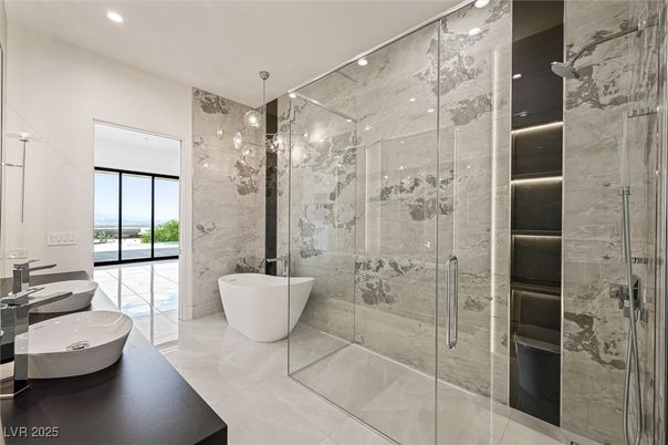 Bathroom, Dual Sink Vanities, Free Standing Baths, Glass Shower, Interior, Marble Walls, Recessed Lighting