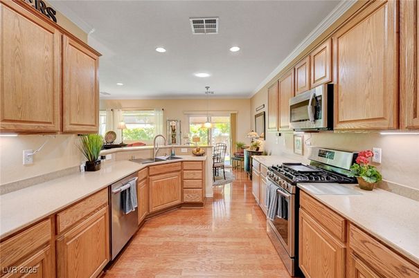 Dining room, Interior, Kitchen, Pendant Lights, Recessed Lighting, Stainless Steel Appliances, Wood Texture Flooring