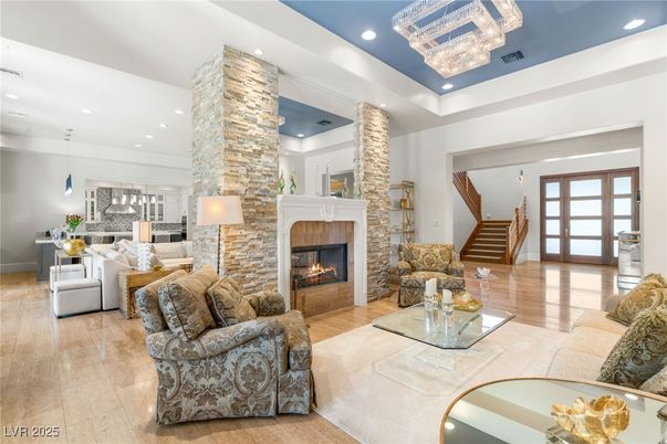 Chandelier, Fireplace, Interior, Kitchen, Living room, Pendant Lights, Recessed Lighting, Wood Texture Flooring
