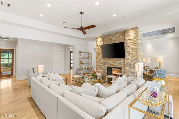 Fireplace, Interior, Living room, Recessed Lighting, Stone Walls, Wood Texture Flooring