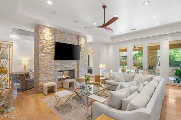 Fireplace, Interior, Living room, Recessed Lighting, Stone Walls, Wood Texture Flooring