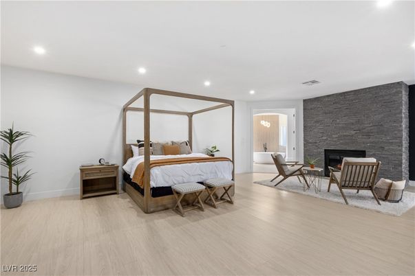 Bedroom, Fireplace, Interior, Recessed Lighting, Stone Walls, Wood Texture Flooring