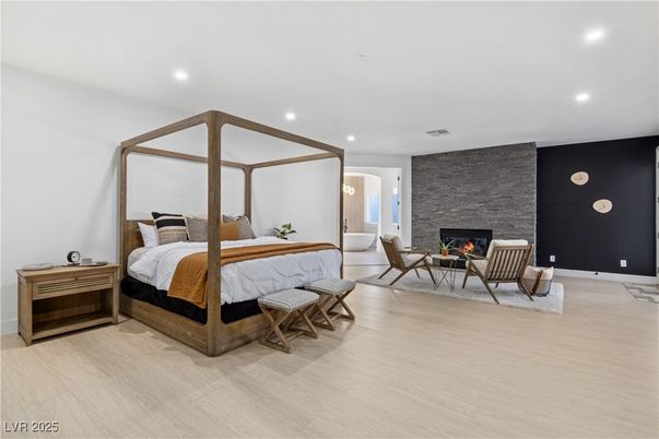 Bedroom, Fireplace, Interior, Recessed Lighting, Stone Walls, Wood Texture Flooring