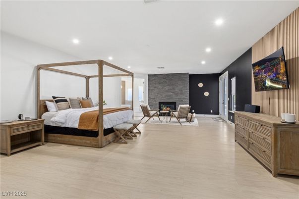 Bedroom, Fireplace, Interior, Recessed Lighting, Stone Walls, Wood Texture Flooring