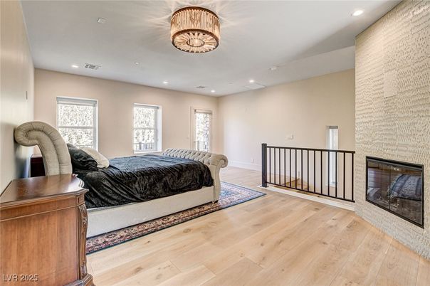Bedroom, Fireplace, Interior, Recessed Lighting, Wood Texture Flooring