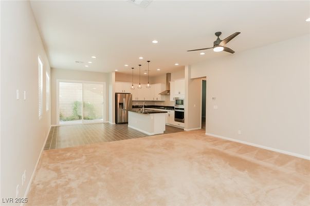Empty room, Interior, Kitchen, Pendant Lights, Recessed Lighting, Stainless Steel Appliances, Wood Texture Flooring