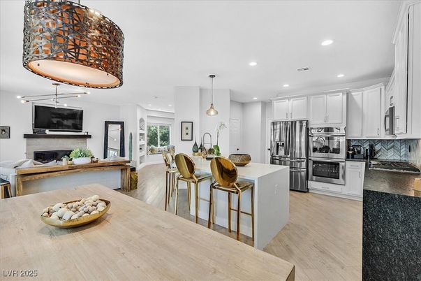 Fireplace, Interior, Kitchen, Pendant Lights, Recessed Lighting, Stainless Steel Appliances, Wood Texture Flooring