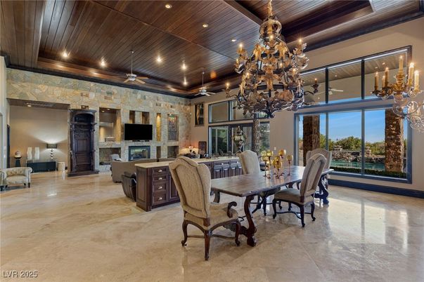 Chandelier, Dining room, Fireplace, Interior, Recessed Lighting, Stone Walls, Wooden Ceilings