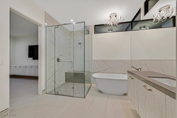 Bathroom, Dual Sink Vanities, Free Standing Baths, Glass Shower, Interior, Marble Walls, Recessed Lighting