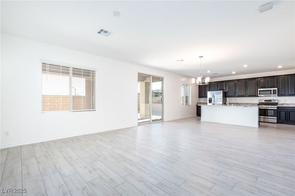 Empty room, Interior, Kitchen, Pendant Lights, Recessed Lighting, Stainless Steel Appliances, Wood Texture Flooring