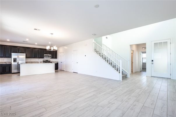 Chandelier, Empty room, Interior, Kitchen, Pendant Lights, Recessed Lighting, Stainless Steel Appliances, Wood Texture Flooring