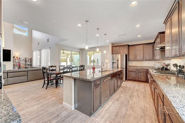 Dining room, Interior, Kitchen, Pendant Lights, Recessed Lighting, Stainless Steel Appliances, Wood Texture Flooring