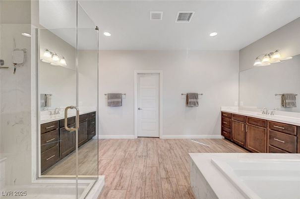 Bathroom, Dual Sink Vanities, Glass Shower, Interior, Recessed Lighting, Wood Texture Flooring