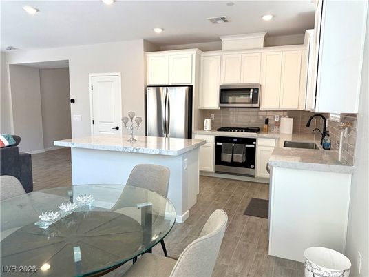 Dining room, Interior, Kitchen, Recessed Lighting, Stainless Steel Appliances, Wood Texture Flooring