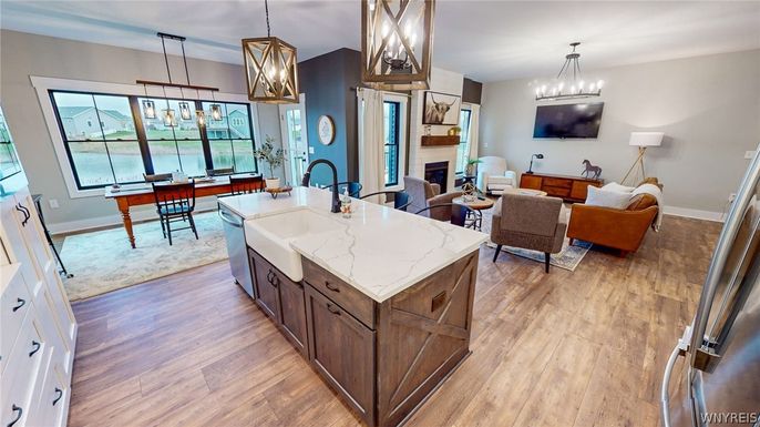 Chandelier, Dining room, Fireplace, Interior, Kitchen, Living room, Pendant Lights, Wood Texture Flooring