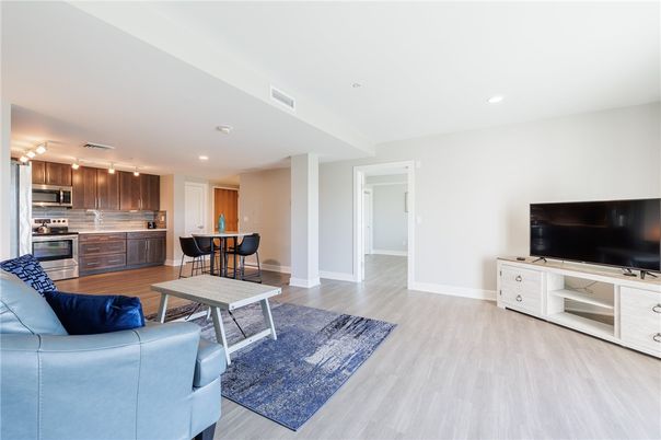 Dining room, Interior, Kitchen, Living room, Recessed Lighting, Stainless Steel Appliances, Wood Texture Flooring