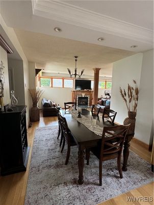 Chandelier, Dining room, Fireplace, Interior, Living room, Recessed Lighting, Wood Texture Flooring