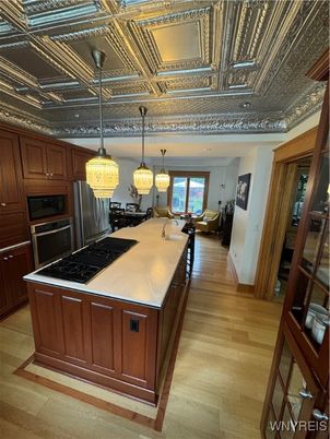 Chandelier, Interior, Kitchen, Pendant Lights, Recessed Lighting, Stainless Steel Appliances, Wood Texture Flooring