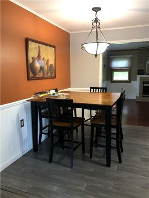 Dining room, Fireplace, Interior, Pendant Lights, Wood Texture Flooring