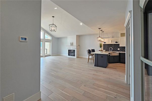 Dining room, Fireplace, Interior, Kitchen, Pendant Lights, Recessed Lighting, Wood Texture Flooring