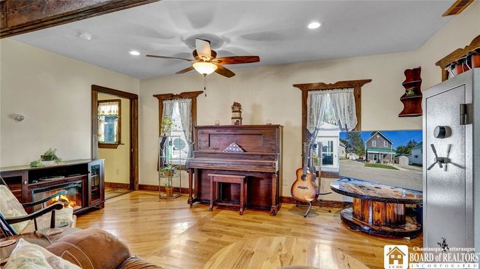 Fireplace, Interior, Piano, Recessed Lighting, Wood Texture Flooring