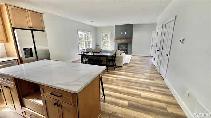 Dining room, Fireplace, Interior, Kitchen, Living room, Recessed Lighting, Wood Texture Flooring