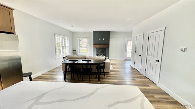 Dining room, Fireplace, Interior, Recessed Lighting, Wood Texture Flooring