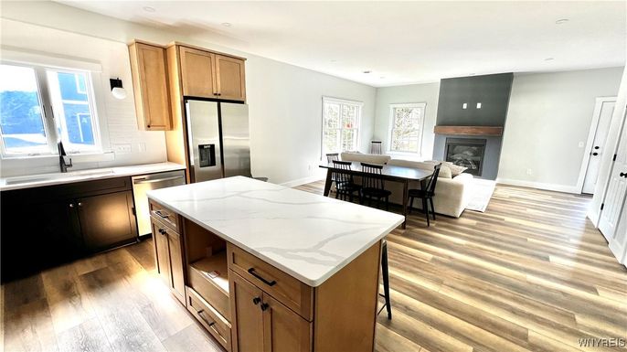 Fireplace, Interior, Kitchen, Living room, Recessed Lighting, Stainless Steel Appliances, Wood Texture Flooring