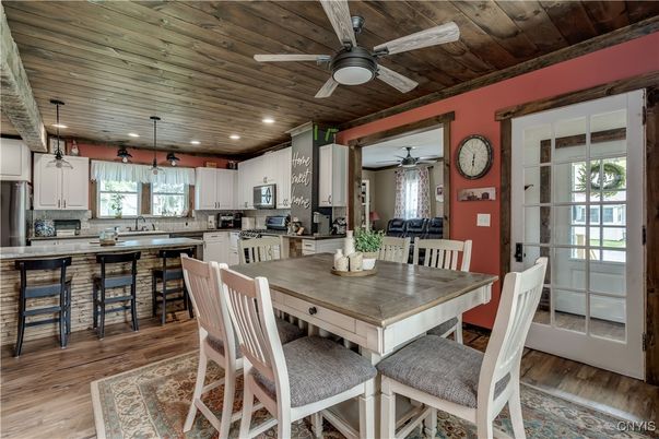 Dining room, Interior, Kitchen, Pendant Lights, Recessed Lighting, Stainless Steel Appliances, Wooden Ceilings, Wood Texture Flooring