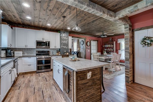 Dining room, Interior, Kitchen, Pendant Lights, Recessed Lighting, Stainless Steel Appliances, Wooden Ceilings, Wood Texture Flooring
