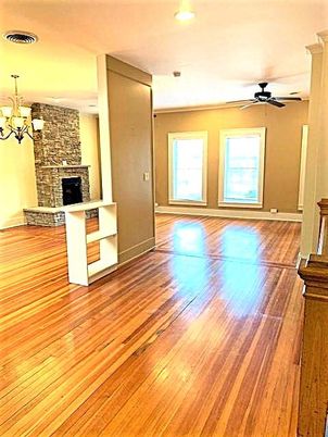 Chandelier, Empty room, Fireplace, Interior, Recessed Lighting, Stone Walls, Wood Texture Flooring
