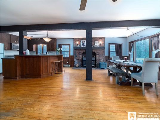 Dining room, Fireplace, Interior, Kitchen, Pendant Lights, Stone Walls, Wood Texture Flooring