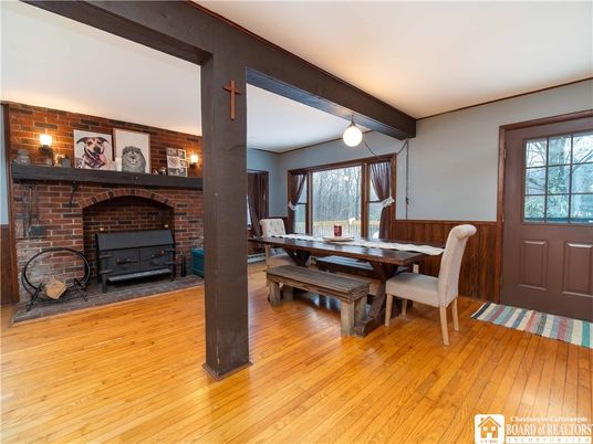 Dining room, Fireplace, Interior, Pendant Lights, Stone Walls, Wooden Beams, Wood Texture Flooring