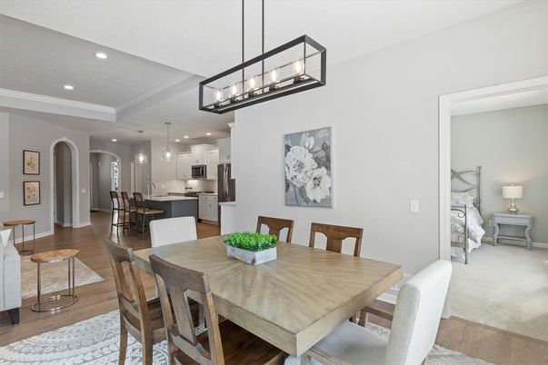 Chandelier, Dining room, Interior, Kitchen, Pendant Lights, Recessed Lighting, Stainless Steel Appliances, Wood Texture Flooring