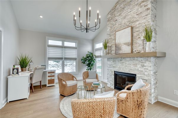Chandelier, Fireplace, Interior, Living room, Recessed Lighting, Stone Walls, Wood Texture Flooring